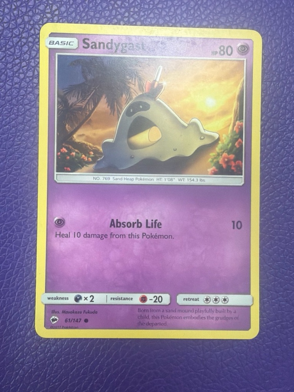 Sandygast Pokémon Card — Purple & Yellow Holo Artwork